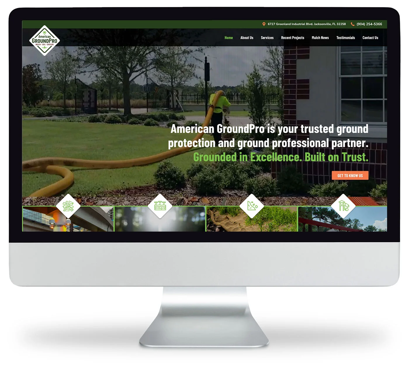 A computer screen displays the American GroundPro website, featuring landscaping images and the text: American GroundPro is your trusted ground protection and ground professional partner.